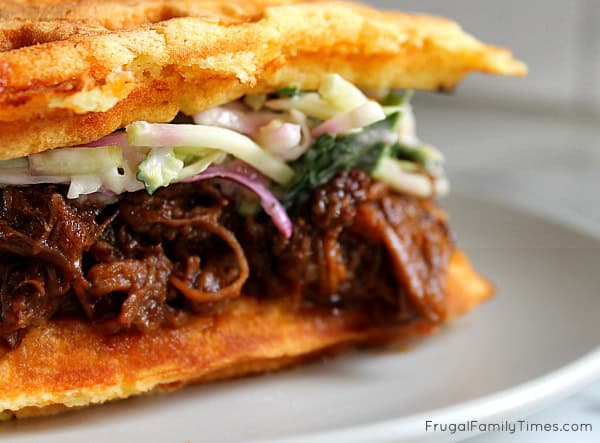 Instant Pot Dark Beer Pulled Brisket on Cheddar Waffles with Blue Cheese Kale Coleslaw | A perfect meal for any game night: Super Bowl football, Basketball play-offs anything where a hearty meal is required. Made in the pressure cooker with Guiness beer. #instantpot #pressurecooker #gamenightrecipe #brisket #beef #beer #Guiness #easyrecipe pulled instant pot beer brisket