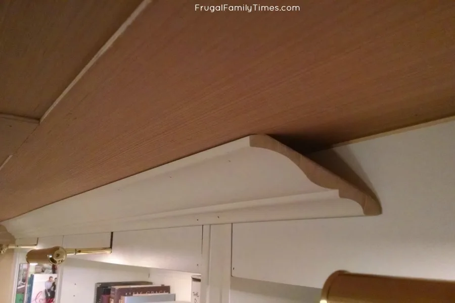 basement wood panel ceiling under crown moulding