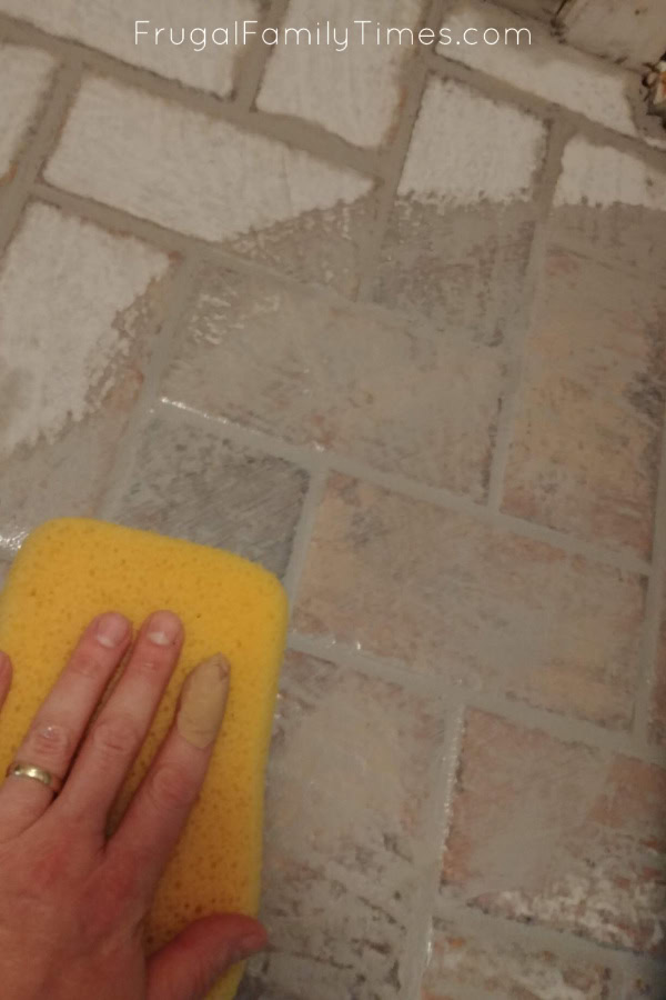 wipe extra grout off of tiles