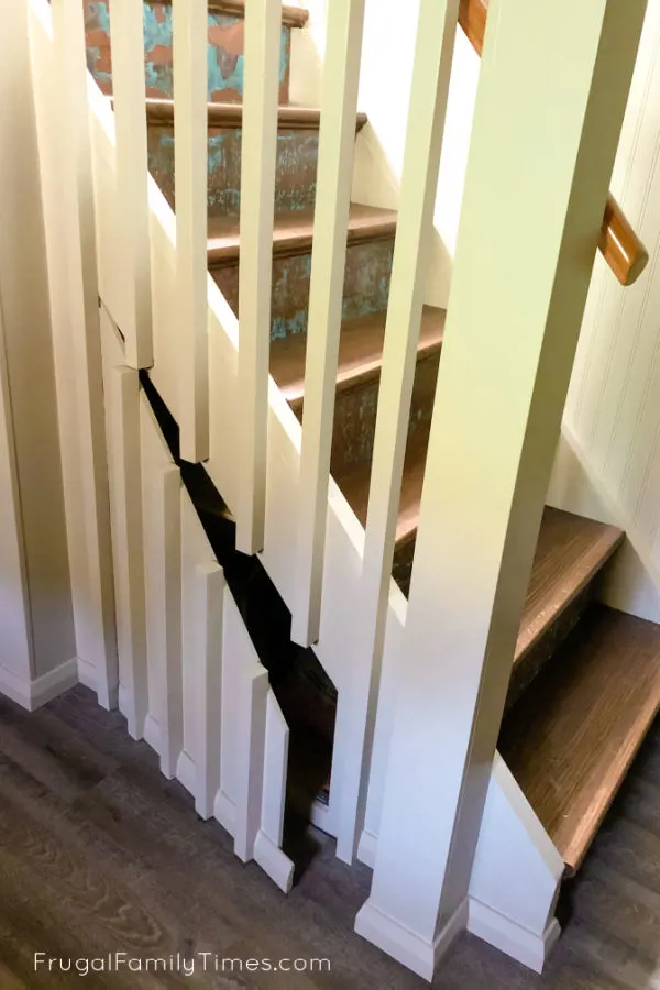 Hidden Storage Under Stairs (with Modern DIY Basement Railing) 22 Hidden Storage Under Stairs open 1