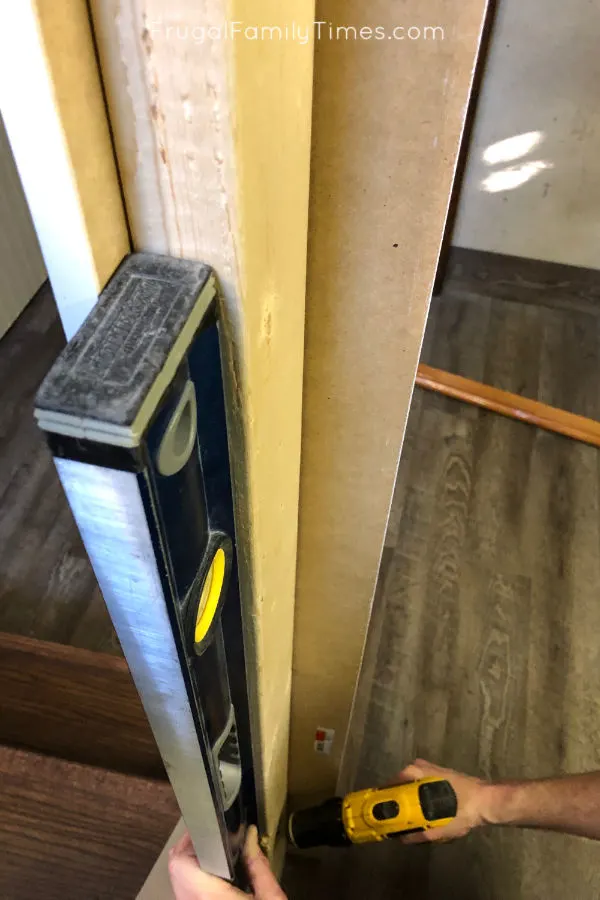 Hidden Storage Under Stairs (with Modern DIY Basement Railing) 4 basement railing making pillar post square