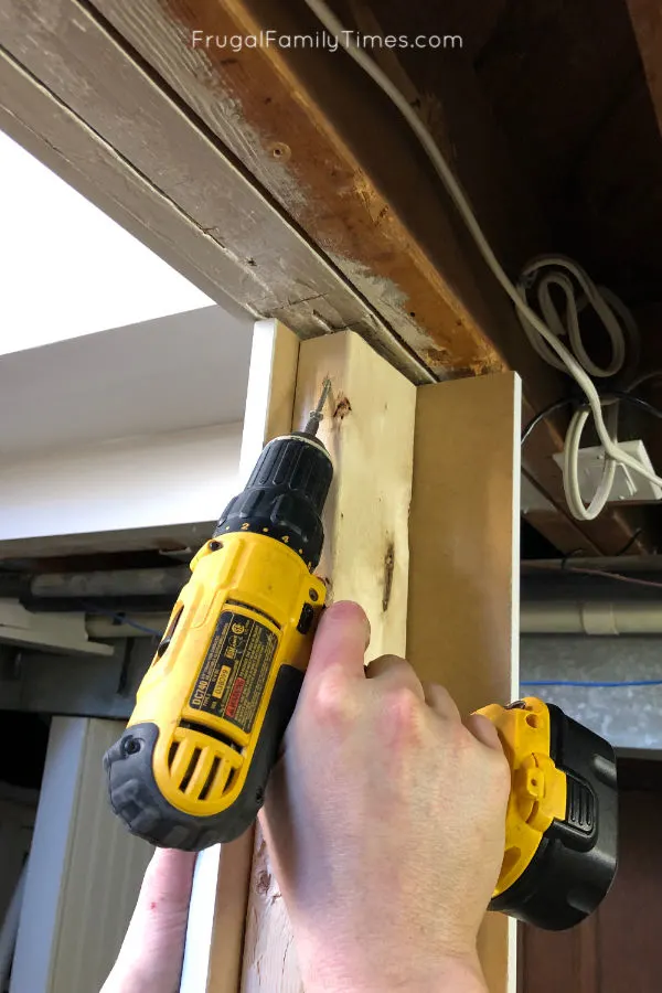 Hidden Storage Under Stairs (with Modern DIY Basement Railing) 3 basement stair railing securing post