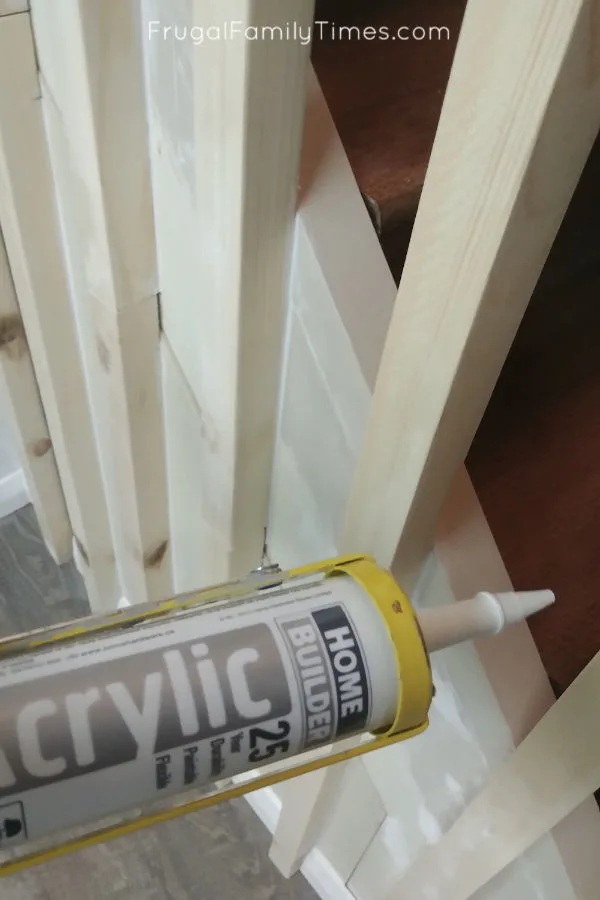 Hidden Storage Under Stairs (with Modern DIY Basement Railing) 18 hidden storage caulk gaps before painting