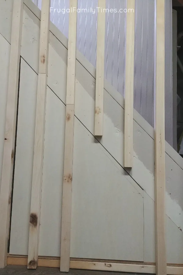 Hidden Storage Under Stairs (with Modern DIY Basement Railing) 15 hidden storage under stairs tape and paint
