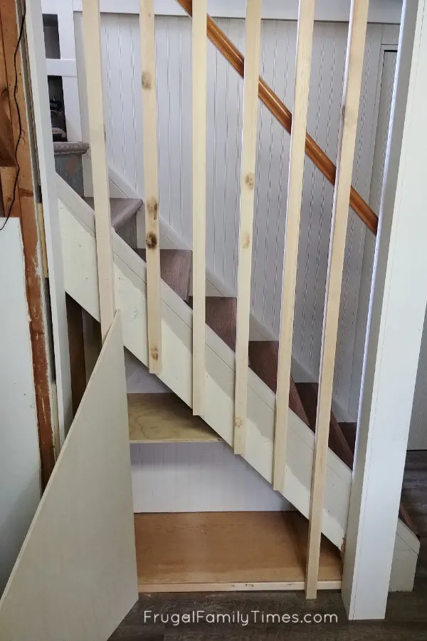 Hidden Storage Under Stairs (with Modern DIY Basement Railing) 12 trial fit door under stairs storage