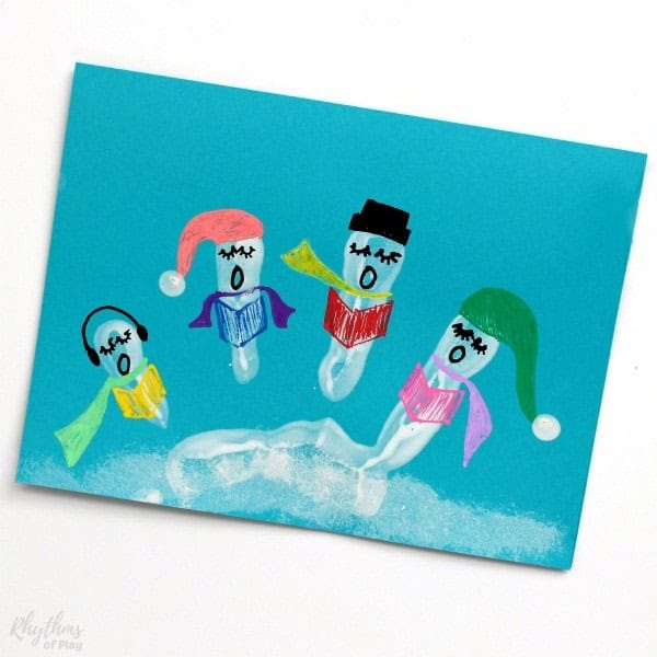 Christmas handprint craft with carolers