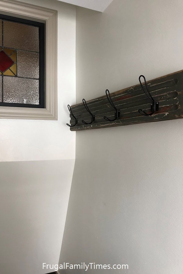 reclaimed wood coat rack in stairwell