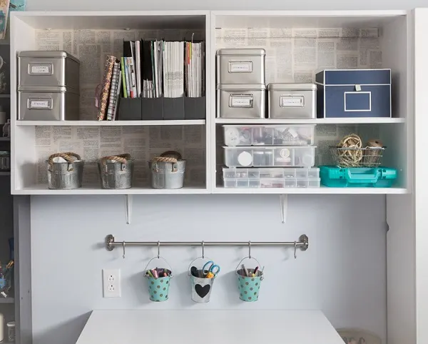 shelves lined with upcycled book pages
