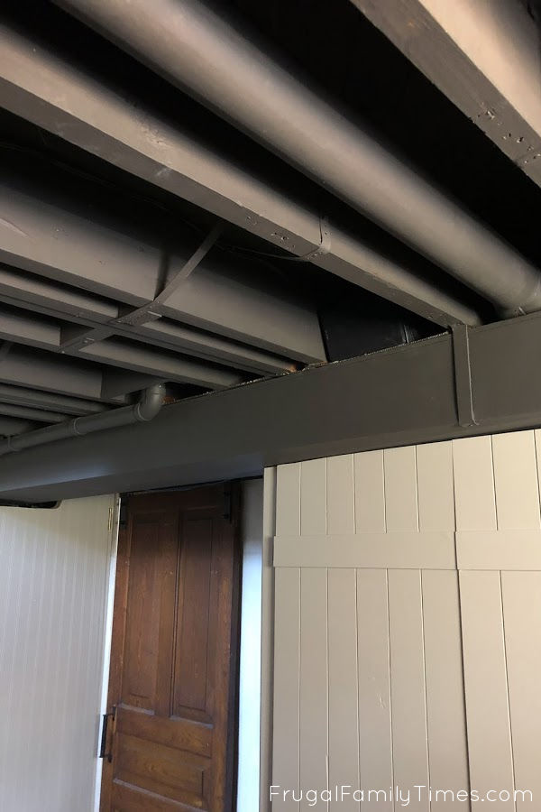 black painted basement ceiling