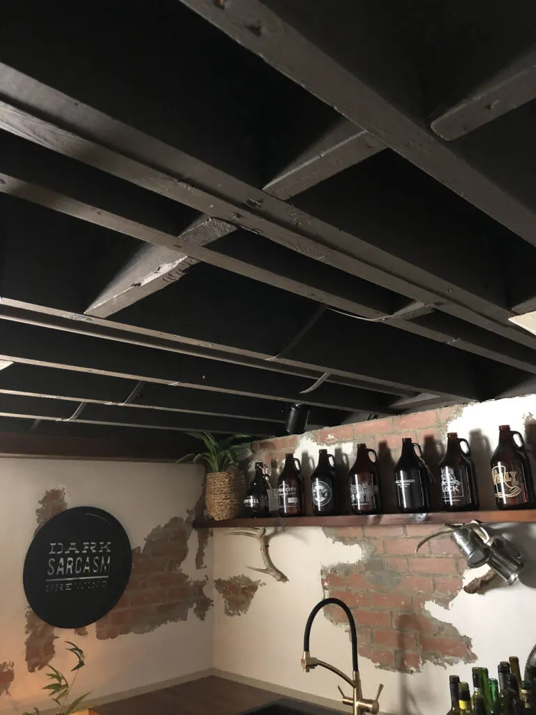 Our Painted Basement Ceiling: WITHOUT a Sprayer and the Perfect Black Paint 8 Painted Black Ceiling Exposed Rafters Basement