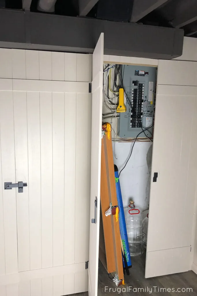 basement built ins hide electrical panel