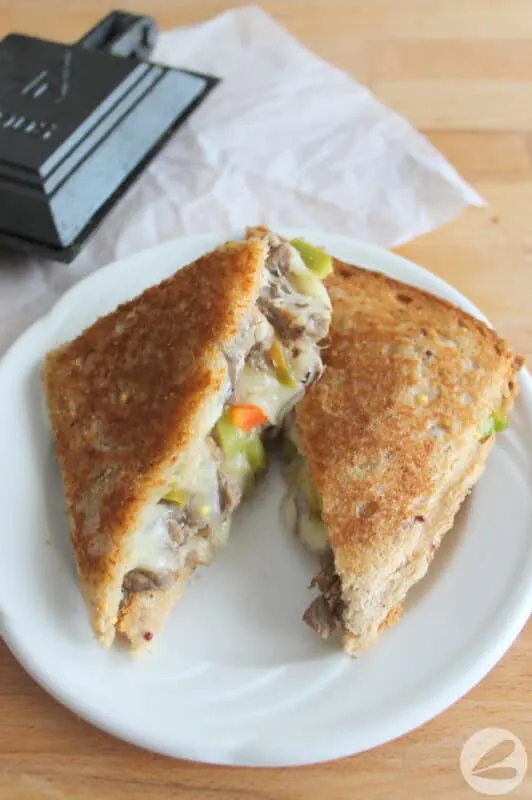 https://www.frugalfamilytimes.com/wp-content/uploads/2022/07/pie-iron-philly-cheesesteak-sandwich-1-8-532x800-1.jpg.webp