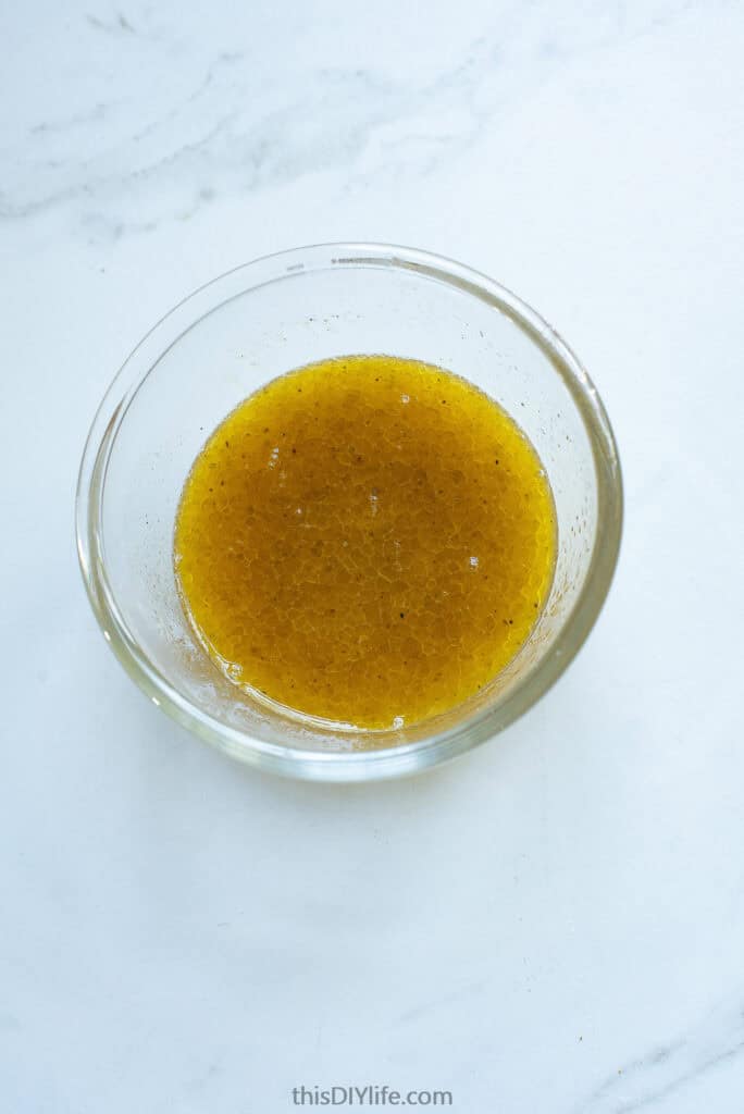 mix garlic, salt, melted butter and oil