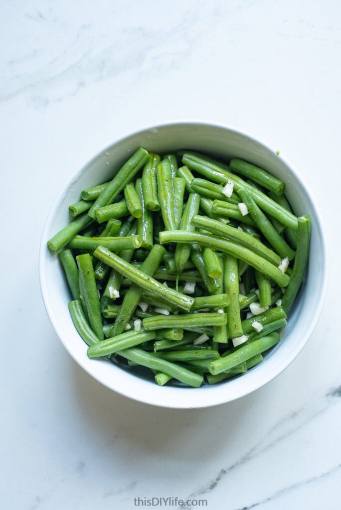 add green beans and garlic butter mixture