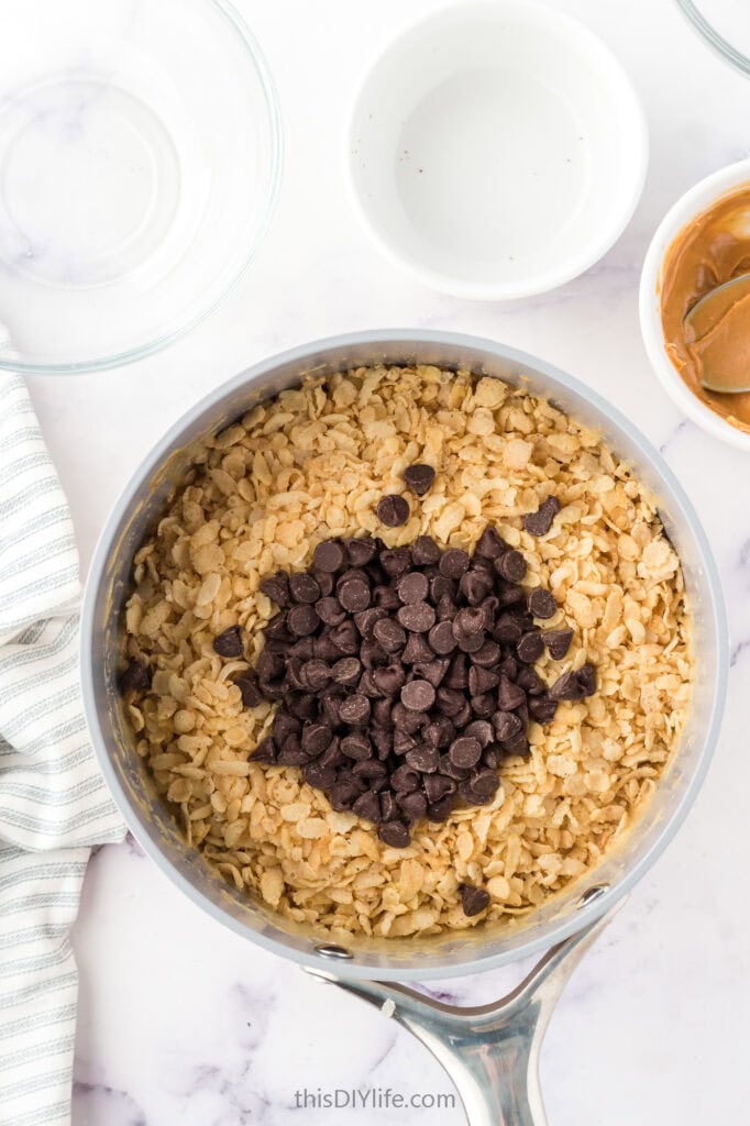 adding chocolate to rice krispie treats