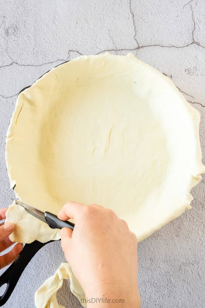 Place the puff pastry. Trim the edges if too much is sticking out of the pan.