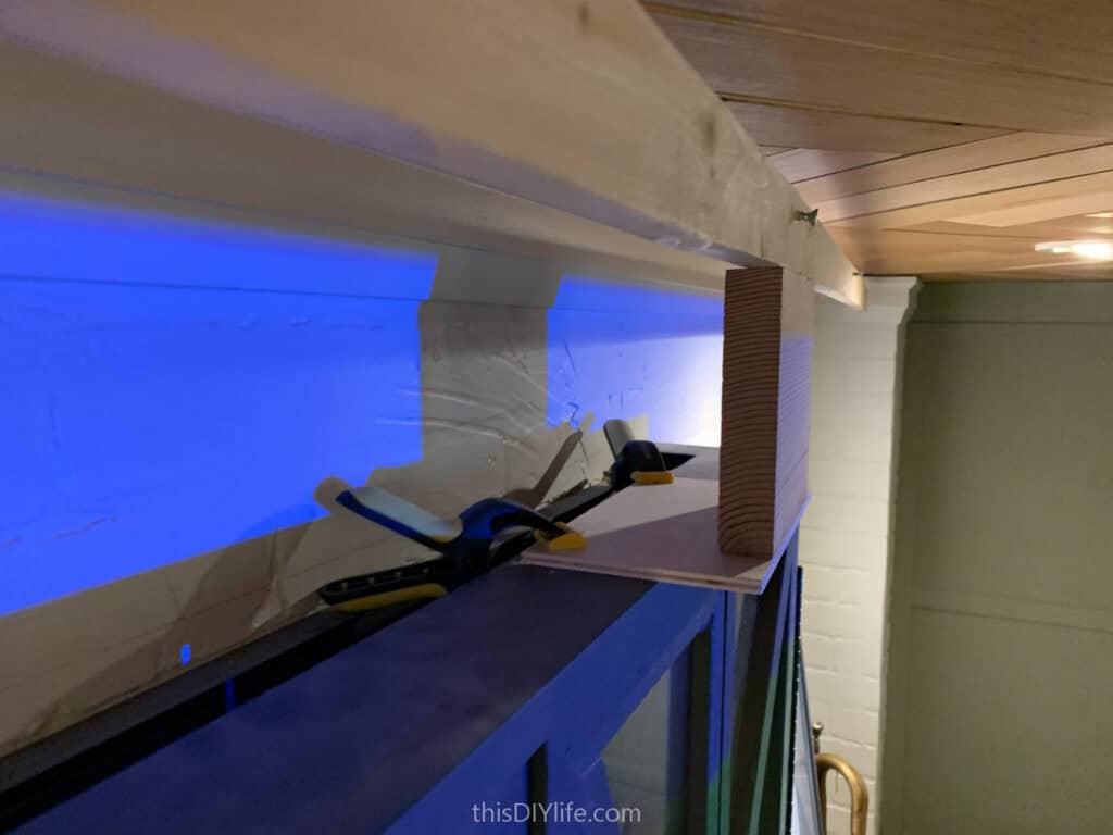 using clamps and wood from temporary screen