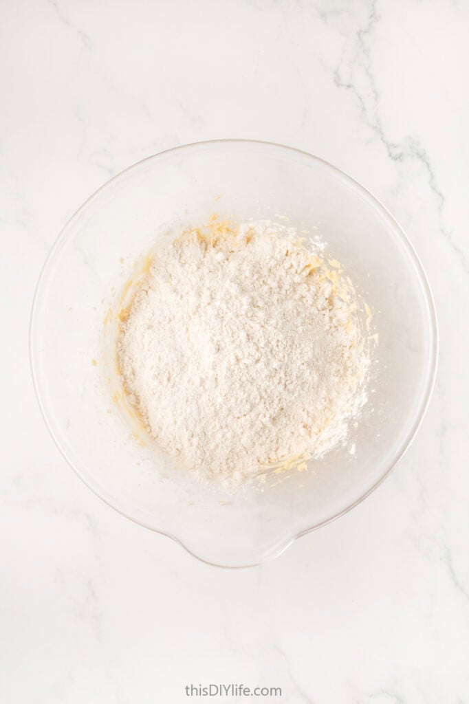 add flour to egg butter sugar mixture